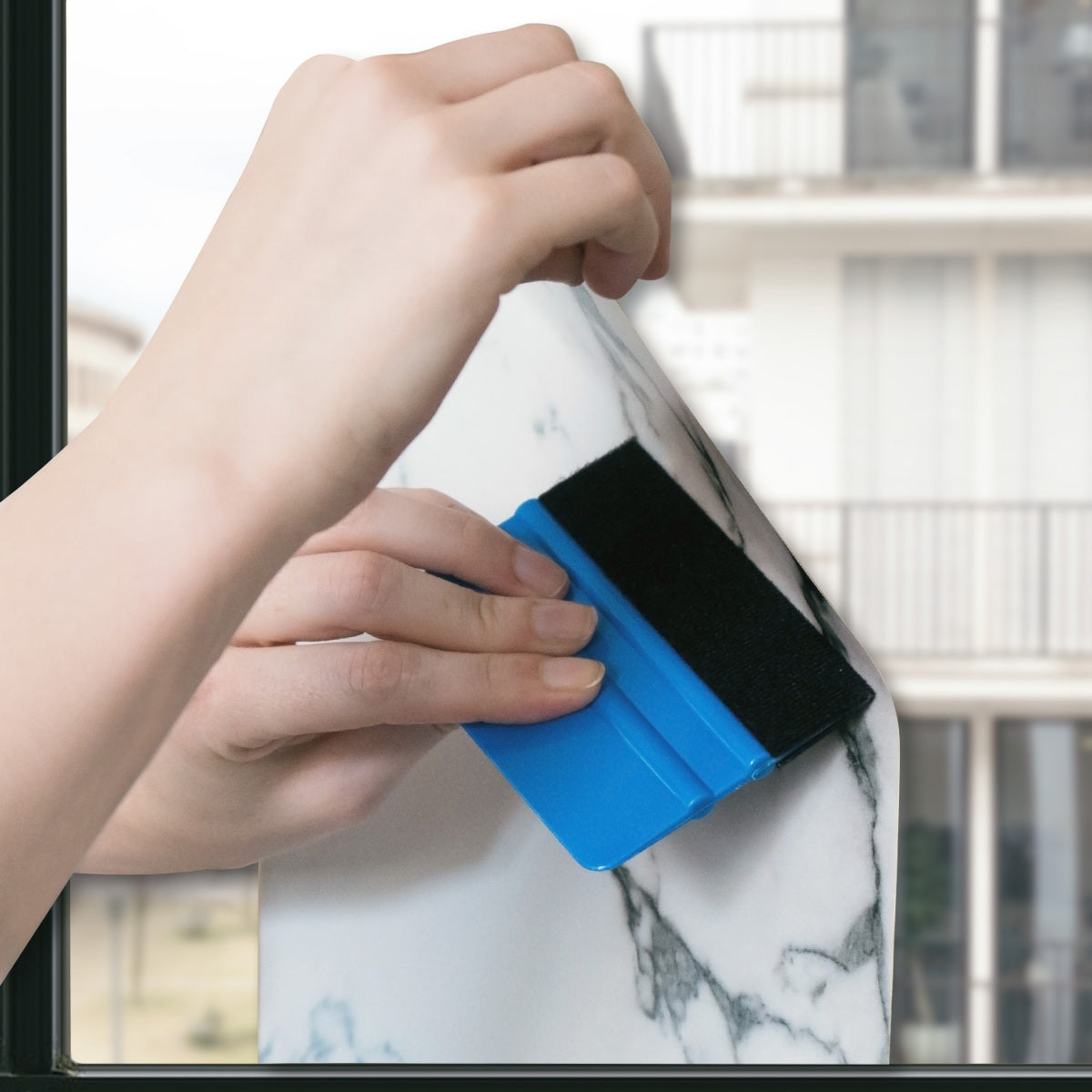 Felt-edged squeegee